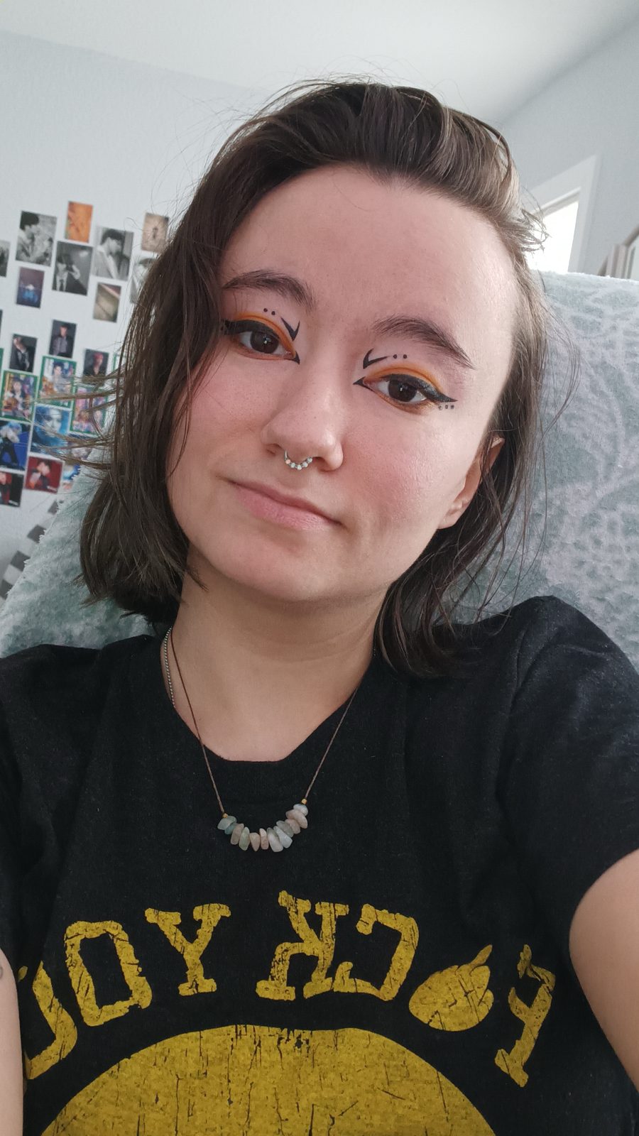 Ember Wing — Molten orange graphic liner against a warm neutral base.