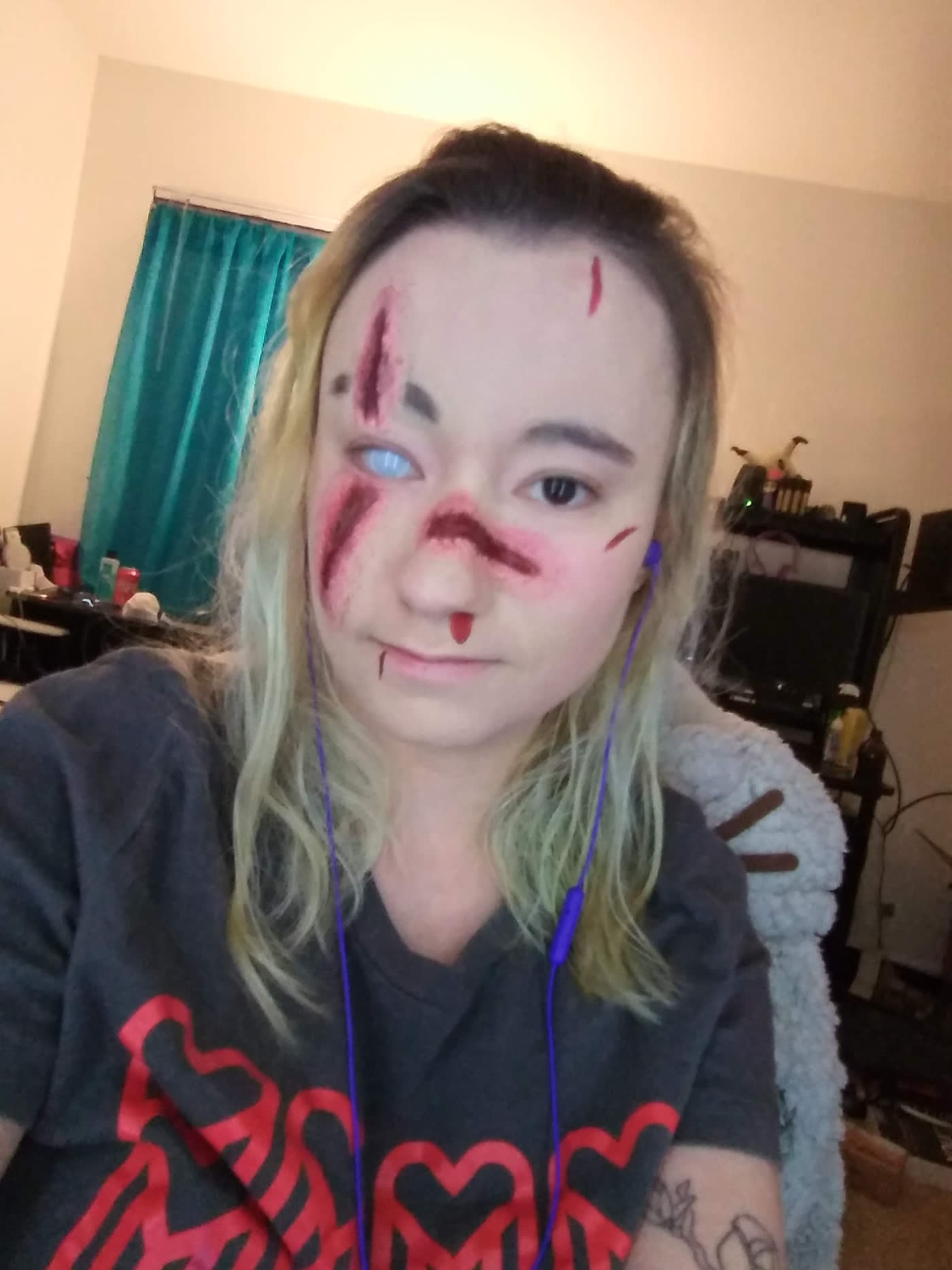 Split Seam — Layered wounds and bruising with a blown-out pale contact lens.