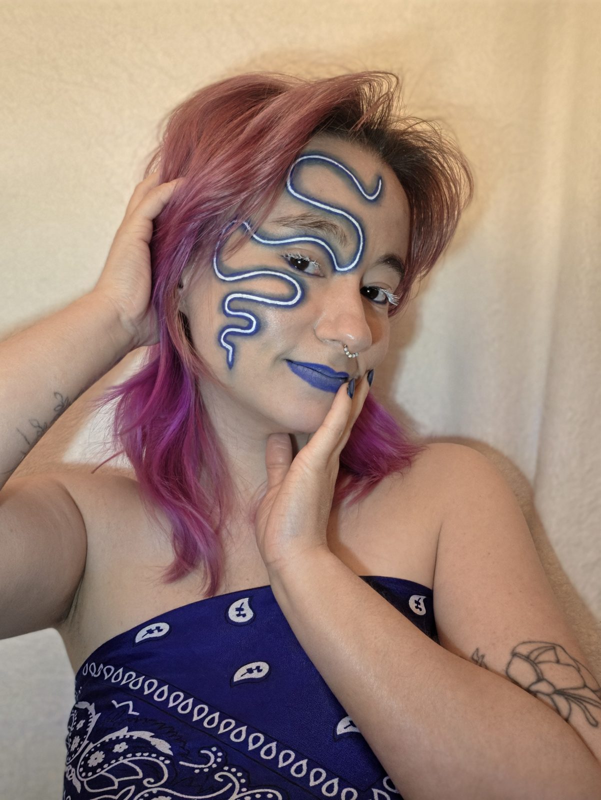 Serpent Sigil — Cobalt line work traced across cheek and brow, matching lip.